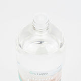 Vista superior de la botella de 1 litro del Aceite de vaselina Cikos neutro para masaje, textura ligera e incolora.