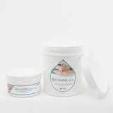 Envases abiertos de crema de masaje CIKOS NEUX de 1 litro y 250 ml mostrando textura neutra.