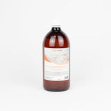 Botella de 1 litro de aceite de almendra dulce Cikos con vitamina E, formulado para masaje relajante y cuidado de la piel.