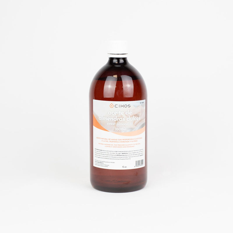 Botella de 1 litro de aceite de almendra dulce Cikos con vitamina E, formulado para masaje relajante y cuidado de la piel.